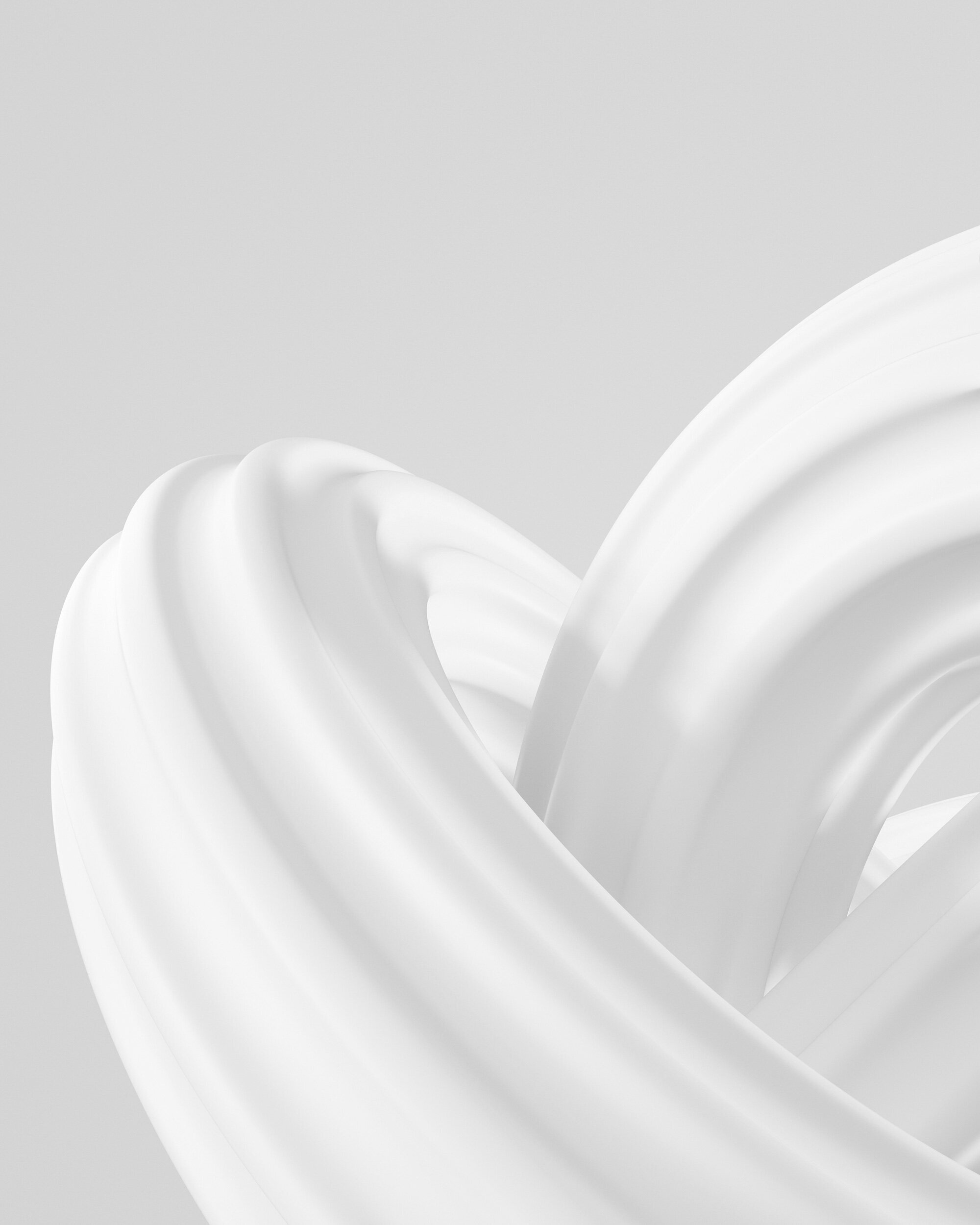 A smooth white sculptural form, coiled on itself